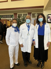 UK HealthCare Providers stand in their white coats and masks at CBC
