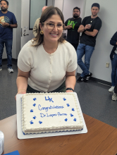 Dr. Lopez-Porras displays her congratulatory cake.