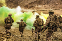 U.S. Marines run to firing positions during live-fire training in Jordan....JPG