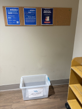 Textbook donation bin under sign