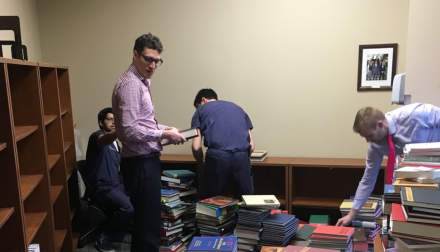 Residents stacking books.