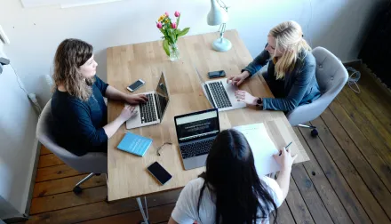 People collaborating around a table.