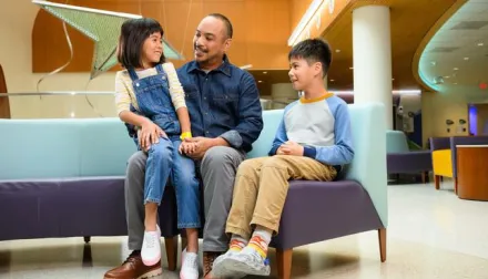 group sitting in new child unit waiting
