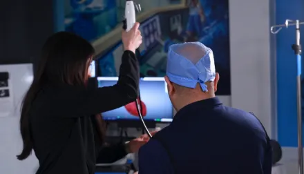 A resident and medical technician working through a simulation training.