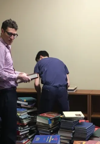 Residents stacking books