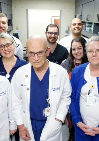 The Multidisciplinary Endocarditis Team poses in their white coats