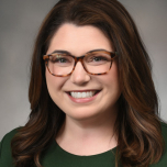 Women with glasses smiling for the camera
