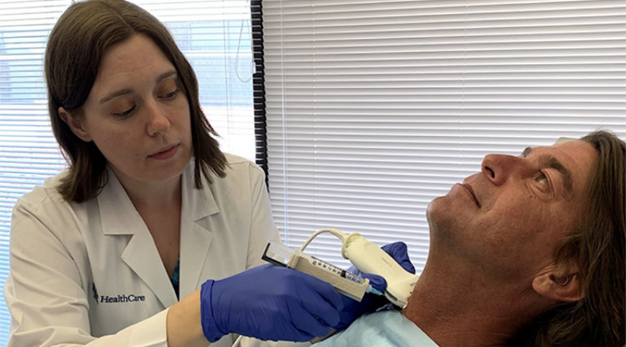Dr. Richards performing an ultrasound-guided fine needle aspiration of a neck lesion.