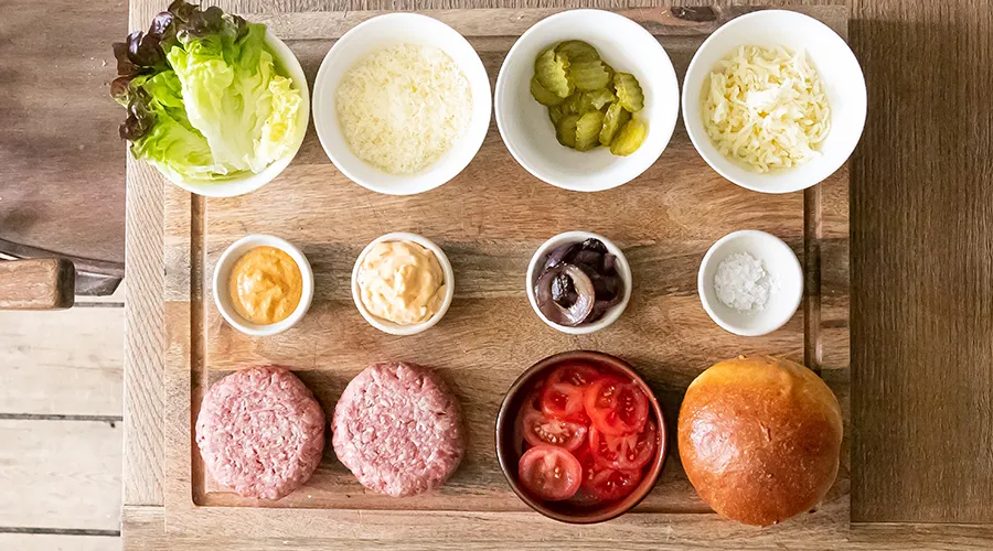 Pinch bowls of ingredients on a cutting board.