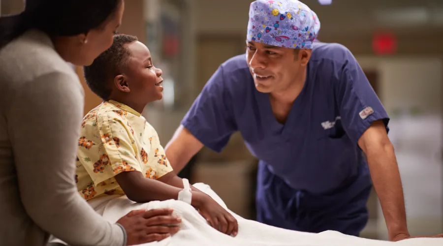 Doctor consulting child in lab room