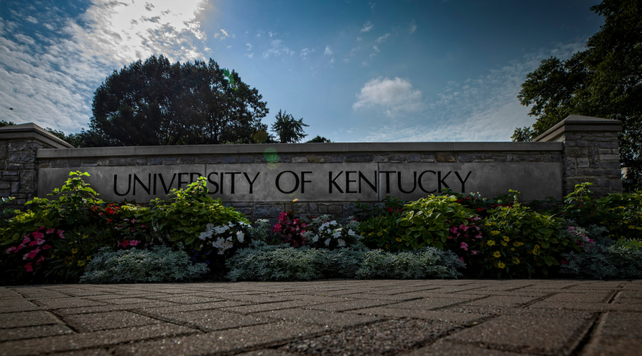 University of Kentucky sign with flowers around it