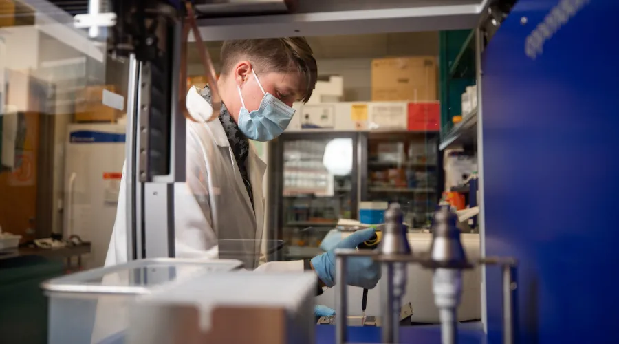 researcher in a laboratory with equipment