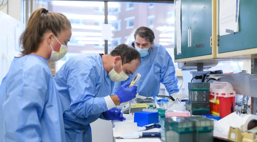 3 technicians or researchers completing laboratory testing