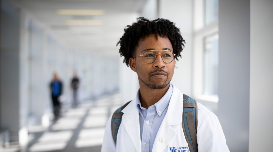 Portrait photo of a UK medical student in their white coat