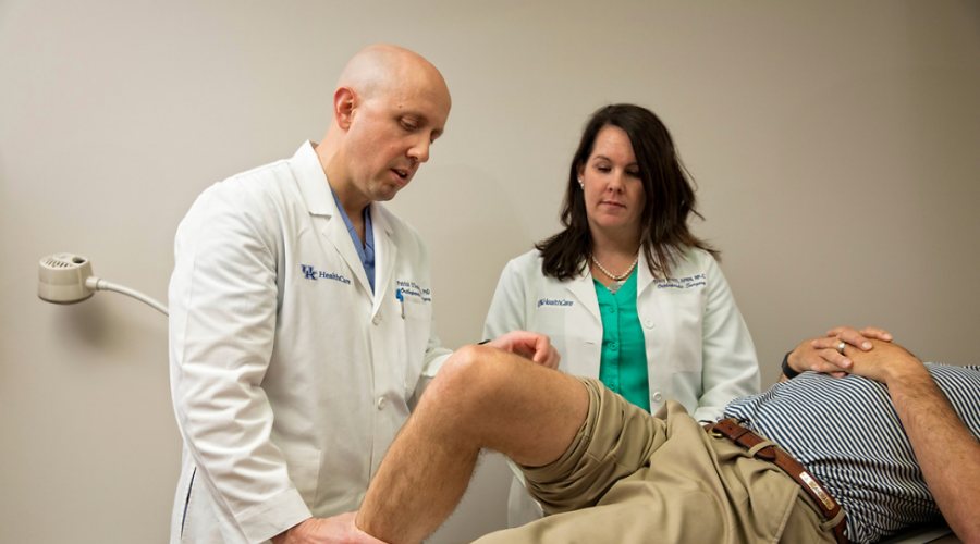 Dr. Patrick O'Donnell, and nurse practitioner Tracy Profitt examining a patient's knee