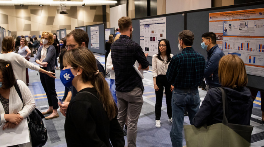 lots of people at a student research poster presentations