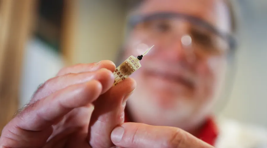 researcher with a microelectrode