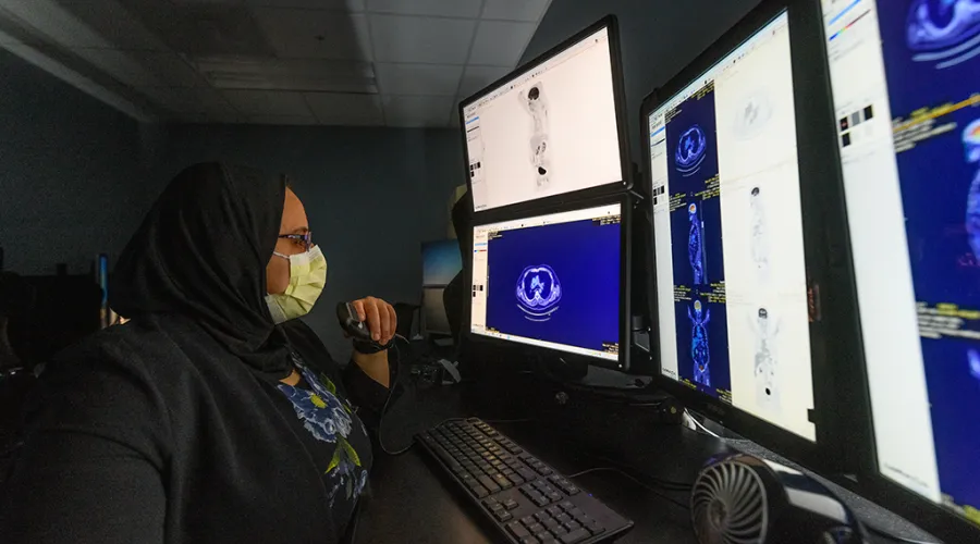 Radiology staff member working in the radiology reading room