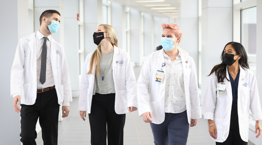 medical students walking down a hallway