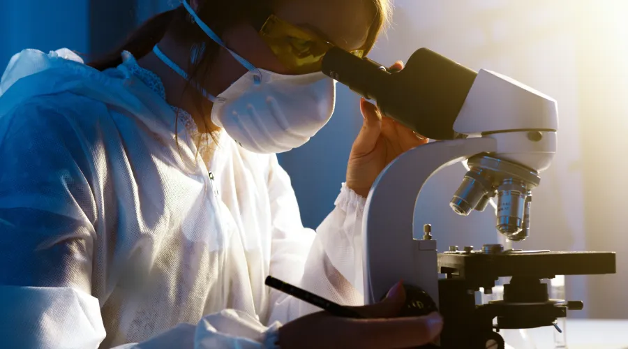 Woman using a microscope.