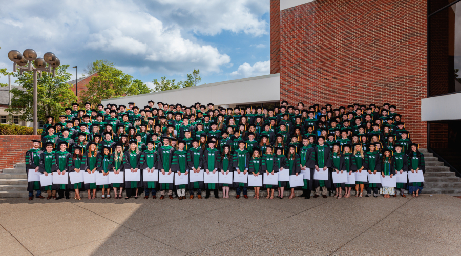 composite photo of the entire class of 2023 in cap and gown