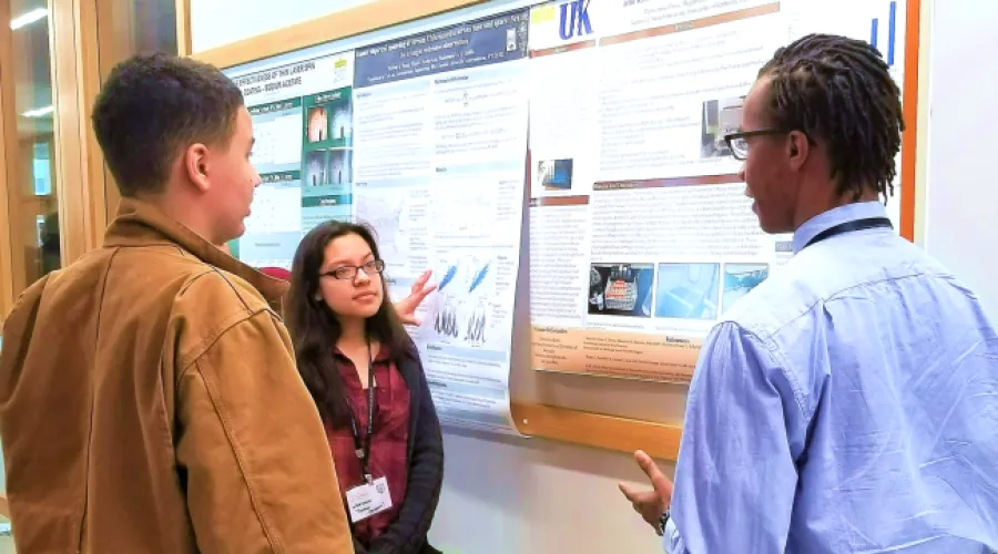 Undergraduate student presenting a poster.