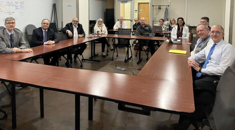 meeting of the faculty council around a conference table