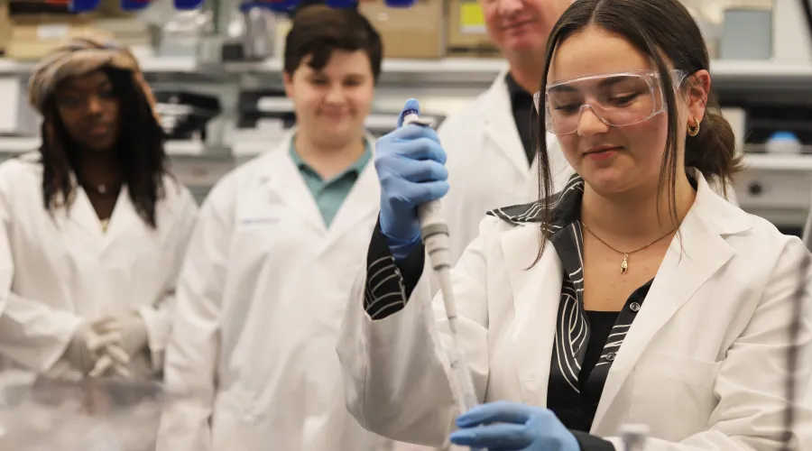 Researcher in lab using pipette