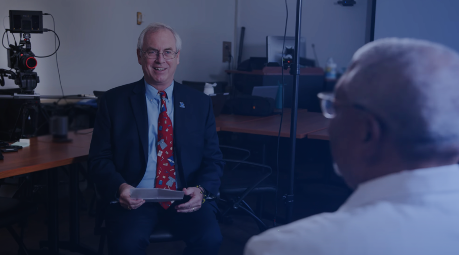dean griffith interviewing a department chair in front of a camera