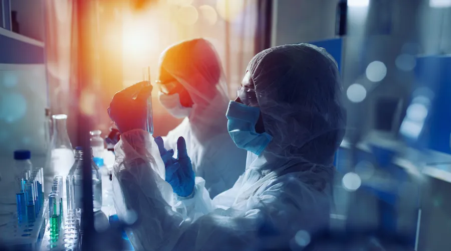 researcher studying diseases in a lab