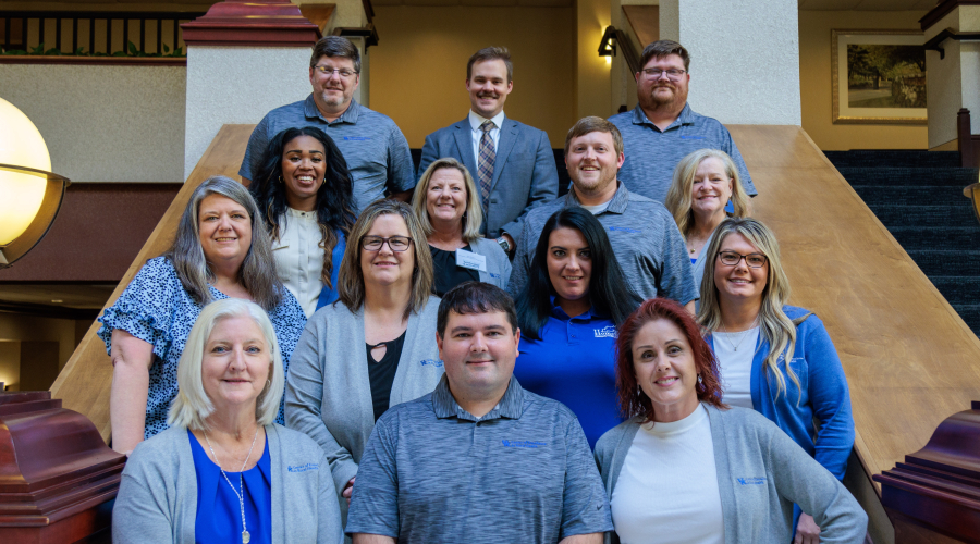 Rural Kentucky Telehealth team gathered on the stairs for a photo.