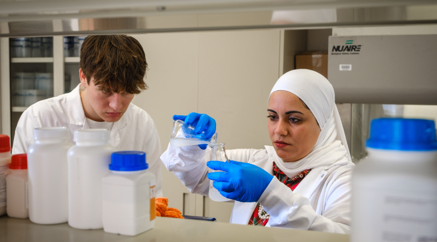 Dr. Yosra Helmy and undergraduate student working on drug discovery.