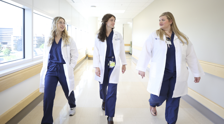 UK HealthCare OBGYN residents walking in hallway 