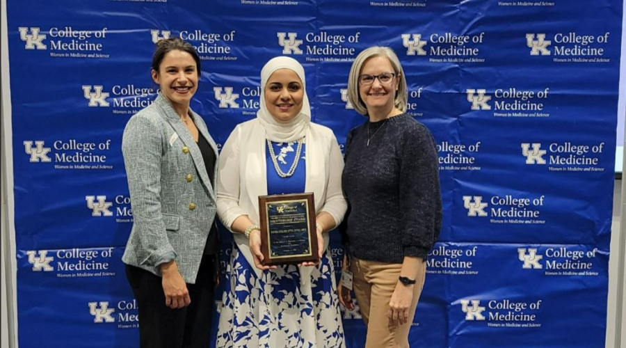 Dr. Yosra Helmy Accepting the Women in Medicine and Science Mentorship Award