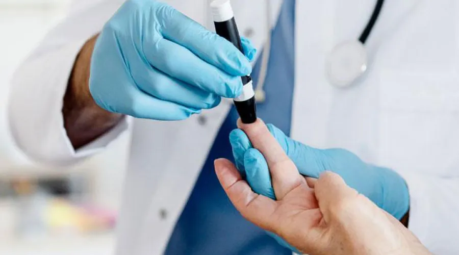 Picture of patient getting glucometer reading