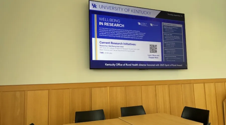 TV image with a slide on it for well-being research