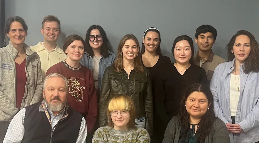 HIV Interprofessional Education Cohort - a group of smiling people, evoking a feeling of camaraderie.