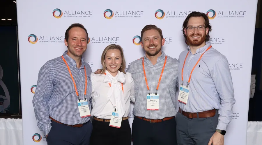 Four Chief Residents smiling next to each other