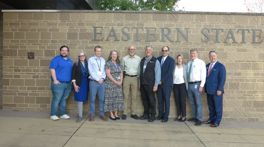 group standing outside entrance to eastern state hospital