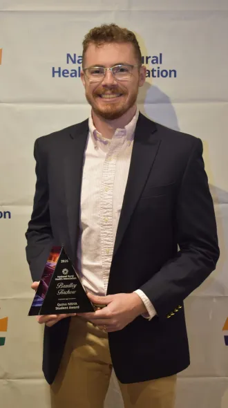 Bradley Firchow poses with NRHA Award
