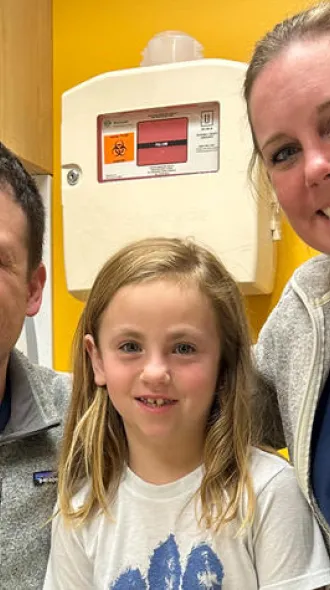 Dr. Eric Rellinger with patient, Caroline.