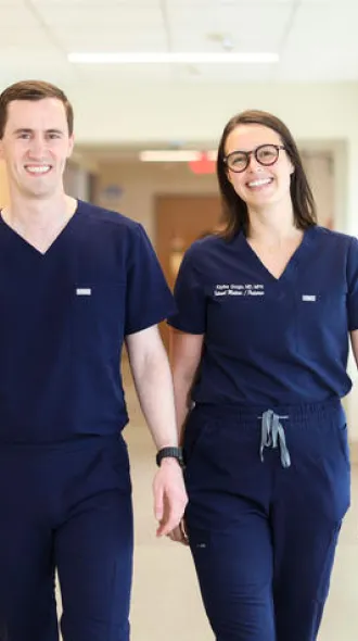 Vince Gouge, MD, pediatric chief resident at UK HealthCare, left, and his wife Kaylee Gouge, MD, internal medicine and pediatric fourth year resident