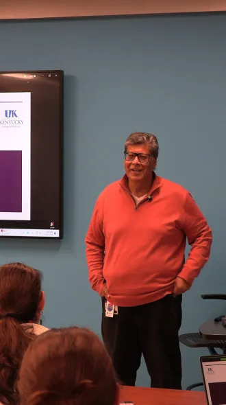 Dr. Hassan greets attendees at conference