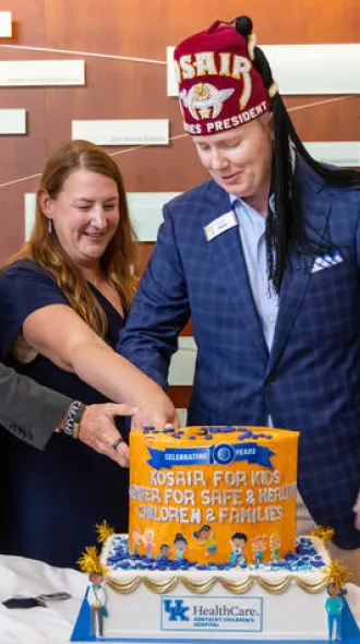 Scottie B. Day, M.D., physician-in-chief for Golisano Children's at UK, Christina Howard, M.D., chief of the Division of Pediatric Forensics Medicine and Barry Dunn, president and CEO of Kosair for Kids.