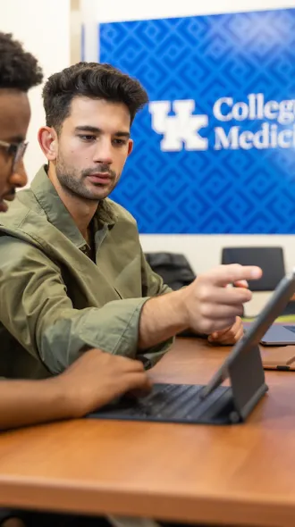 med students in a classroom studying together