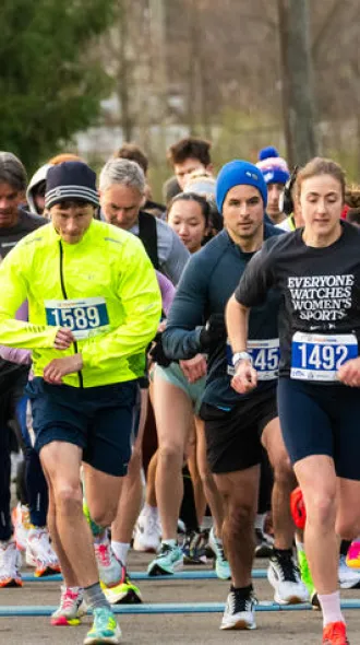 A line of runners participating I the third annual World Hearing Day 5K