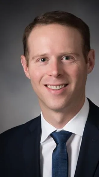 Headshot portrait of Dr. Austin Stone