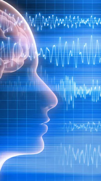 A graphic of the human brain within a silhouette of the human head. Brain waves overlap and travel from left to right of the image.