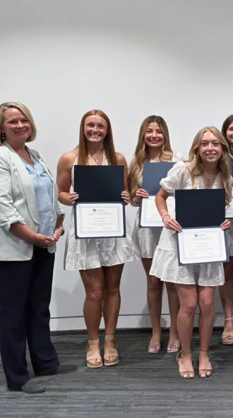2026 CHIP graduates pose holding certificates alongside department leadership