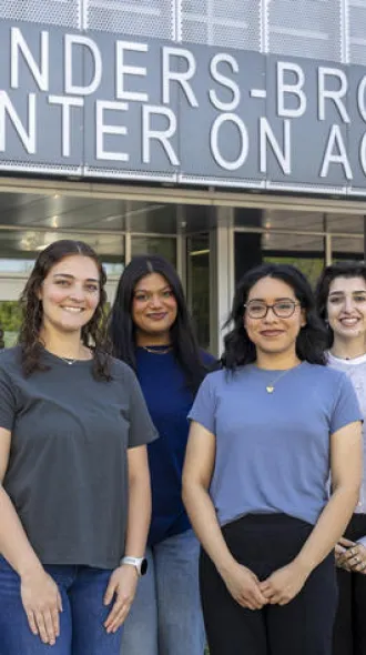 Sierra Turner, Valerie Allen, Meghana Gazula, Andrea Hernandez Gonzalez and Osswaah Fariduddin in front of the Sanders Brown Center on Aging